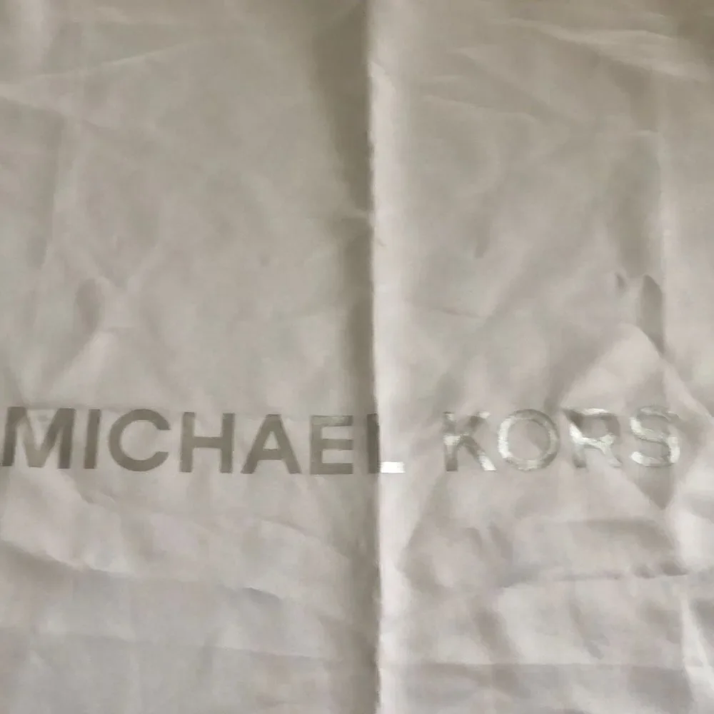 Michael Kors Silky beige large dust bag.
